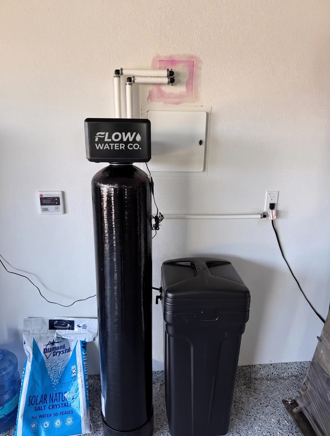 Softener and filtration system plumbed into a home's main water line